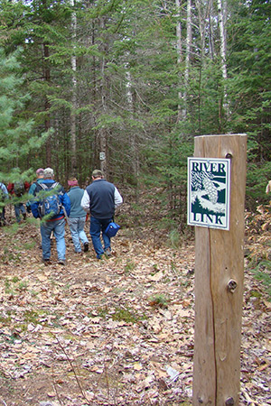 hikers on the River link trail