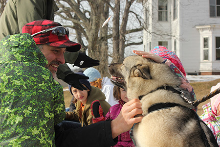 patting the sled dogs