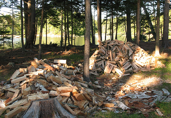 two piles of split firewood