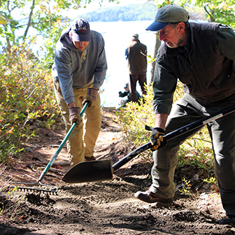 volunteers working on trail at Dodge Point