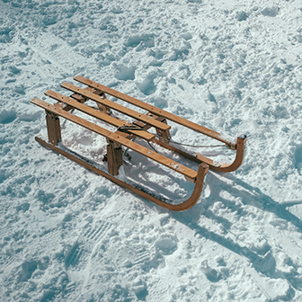 wooden sled in the snow