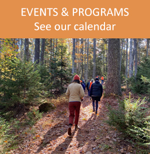 Events & program link with image of people walking on a trail in fall