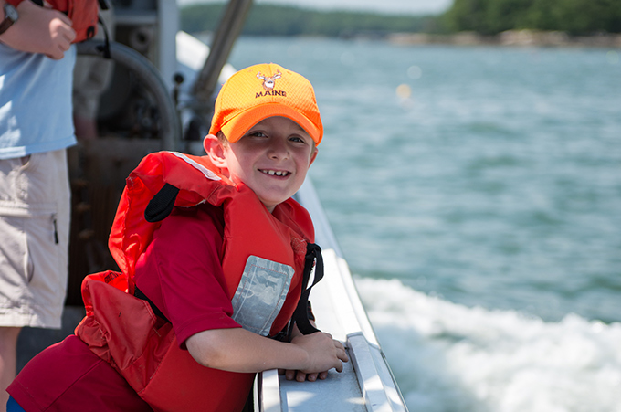happy camper on a lobster boat field trip