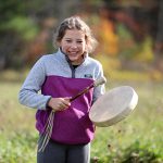 student trying out a small Wabanaki drum